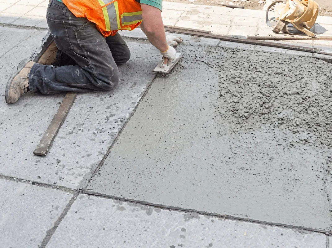 Professional repairing a concrete floor in Tallahassee, FL